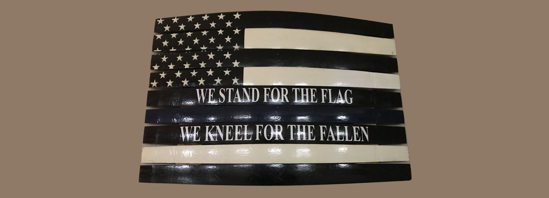 We stand for the flag, we kneel for the fallen